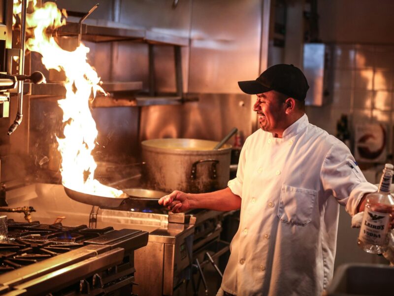 Chef plating a dish at Asante